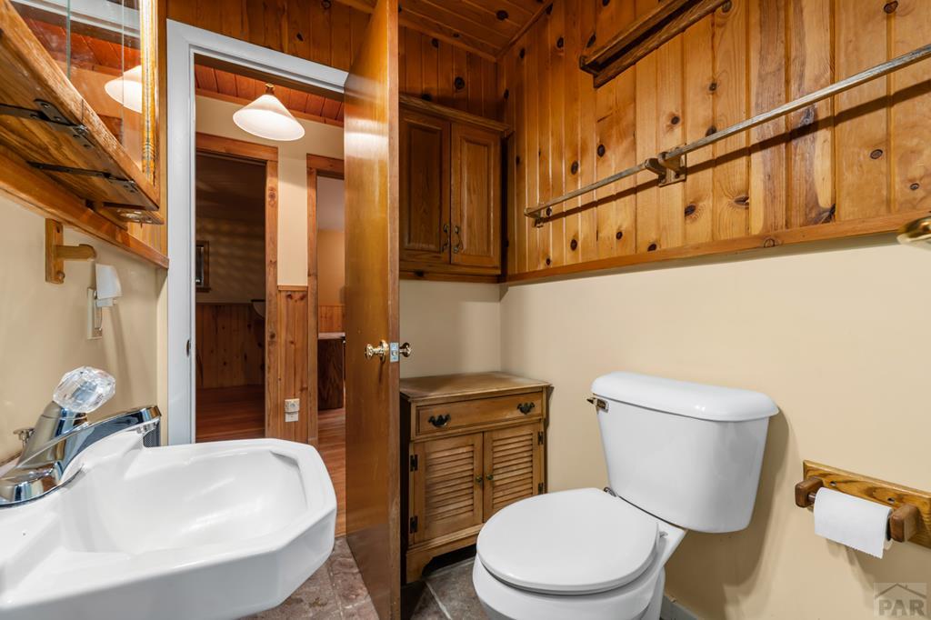 9600 Middle Creek Canyon Road Beulah, CO 81023 - Photo 24 of 50 a white toilet sitting next to a bathroom sink