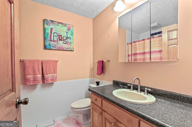 a bathroom with a double vanity sink and mirror