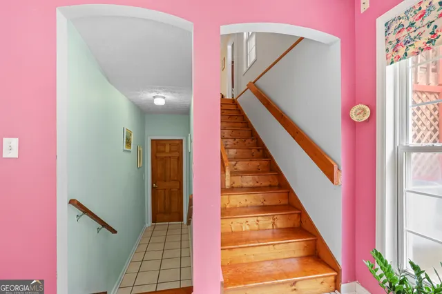 a bedroom with furniture and a fireplace