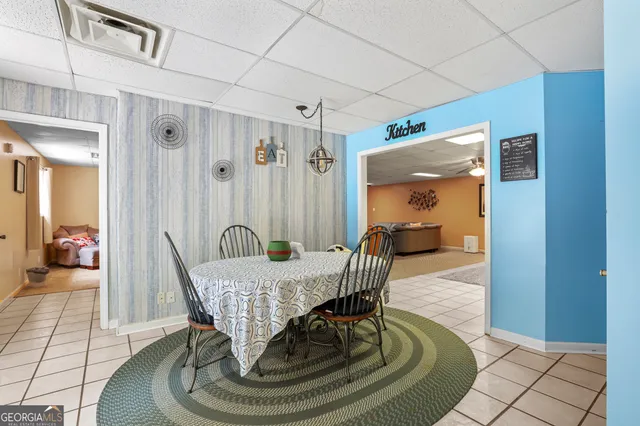 a view of a house with a yard porch and sitting area