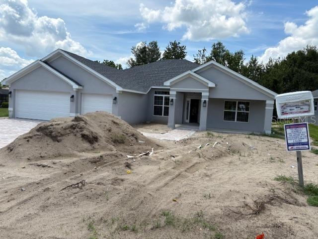 6716 Southwest 179th Ave Road Dunnellon, FL 34432 - Photo 2 of 17 front view of a house with a yard