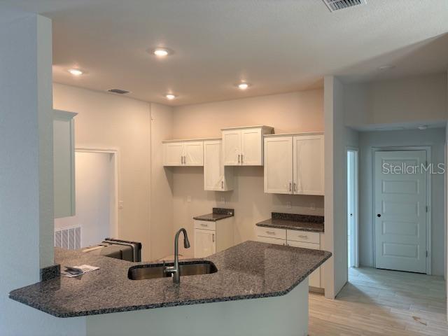 6716 Southwest 179th Ave Road Dunnellon, FL 34432 - Photo 4 of 17 a kitchen with kitchen island granite countertop a sink and a stove