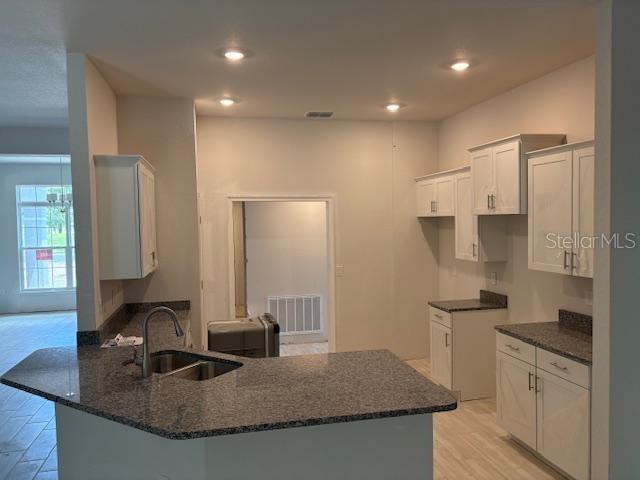 6716 Southwest 179th Ave Road Dunnellon, FL 34432 - Photo 5 of 17 a kitchen with granite countertop a sink a stove and refrigerator