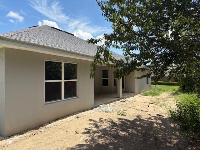 6716 Southwest 179th Ave Road Dunnellon, FL 34432 - Photo 7 of 17 a front view of a house with a yard and garage