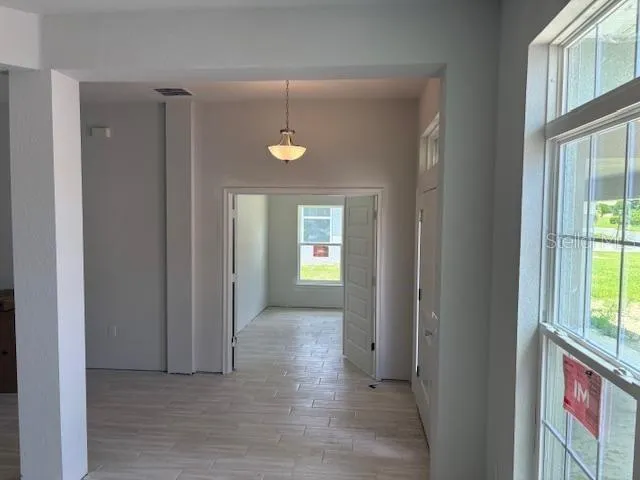 a view of an empty room and window