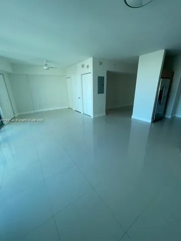 an empty room with mirror in view