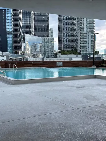a view of a living room and kitchen