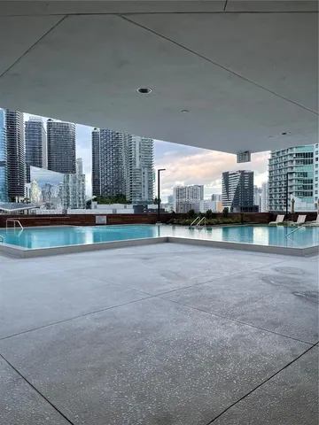 a view of a terrace with outdoor seating and city view