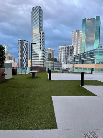 a view of a bench in front of building