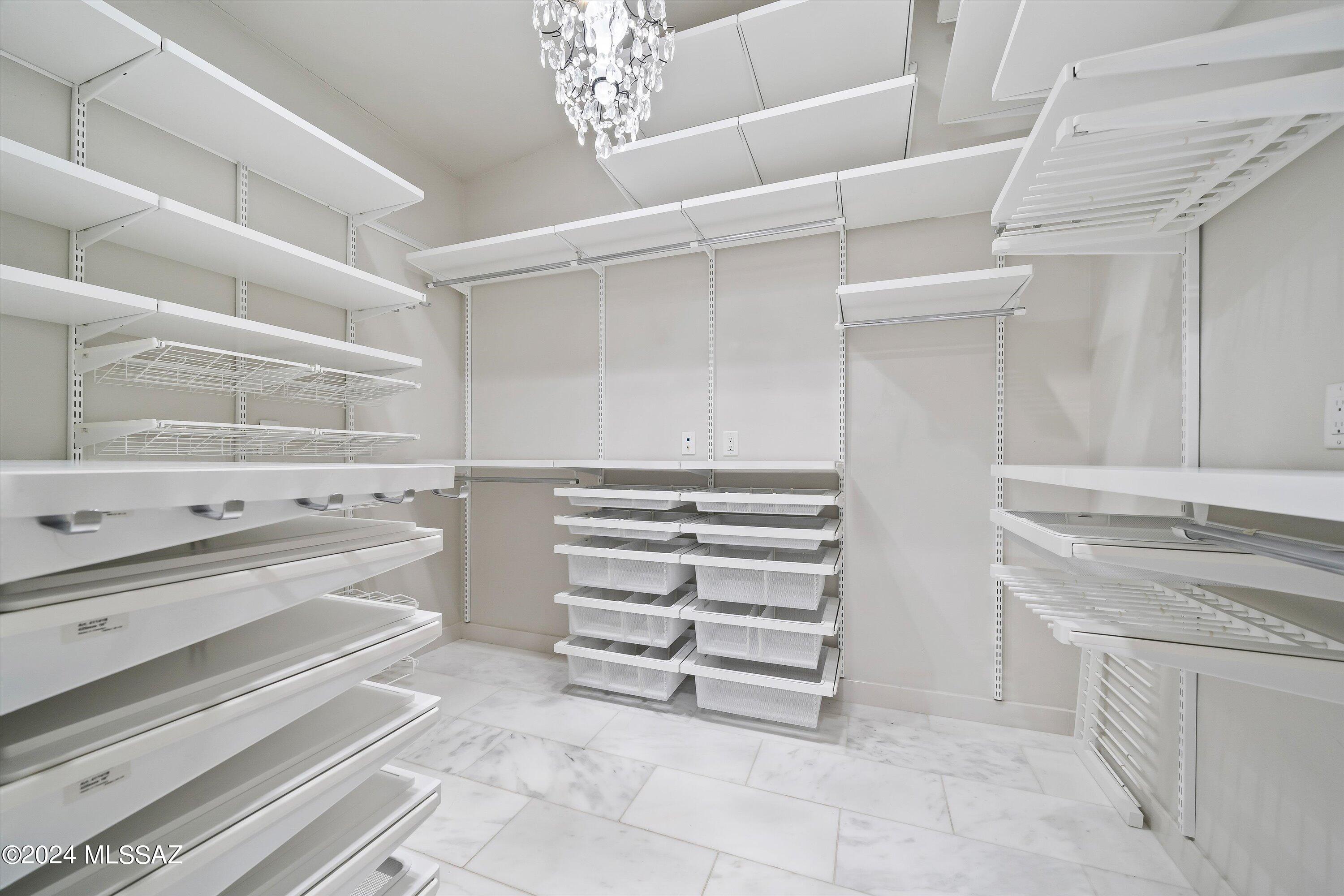 4951 North Valley View Road Tucson, AZ 85718 - Photo 29 of 45 The closet as been totally built out for all your storage needs. Part of the closet is not pictured.