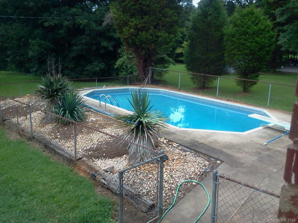 405 Absher Road Bessemer City, NC 28016 - Photo 2 of 15 a view of a swimming pool with a patio
