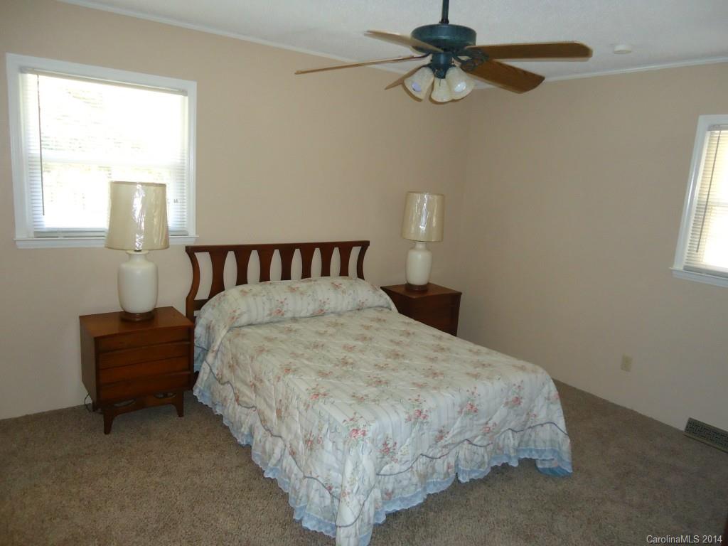 405 Absher Road Bessemer City, NC 28016 - Photo 11 of 15 a bed sitting in a bedroom next to a window