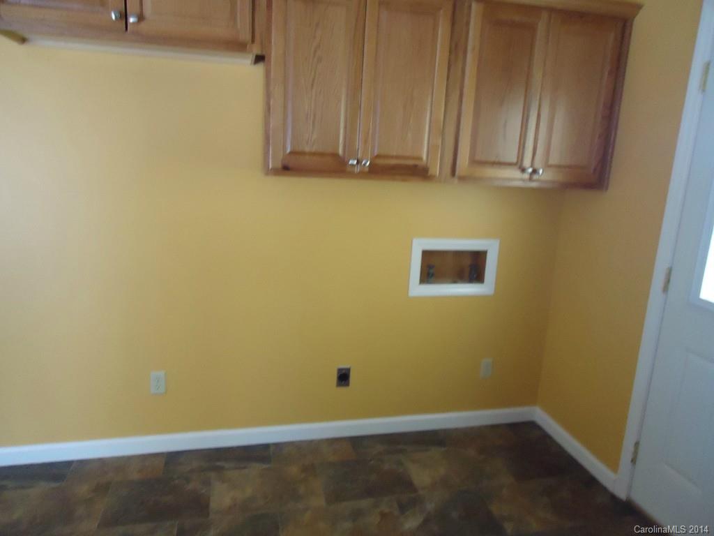 405 Absher Road Bessemer City, NC 28016 - Photo 15 of 15 a view of a room with wooden floor