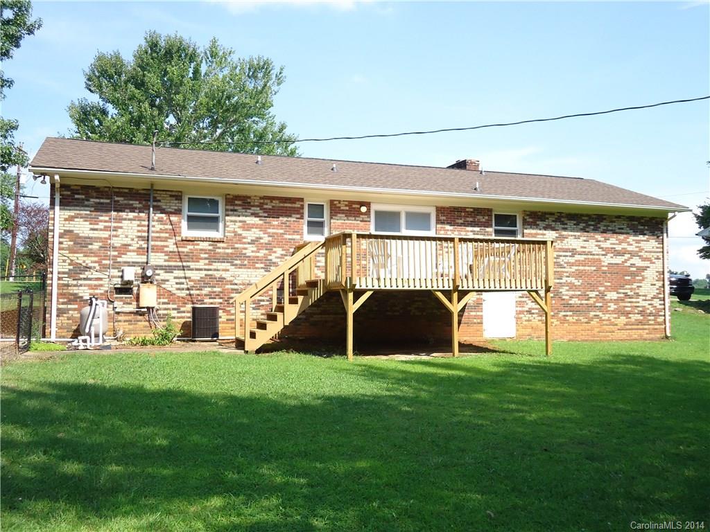 405 Absher Road Bessemer City, NC 28016 - Photo 3 of 15 a view of a porch with a yard