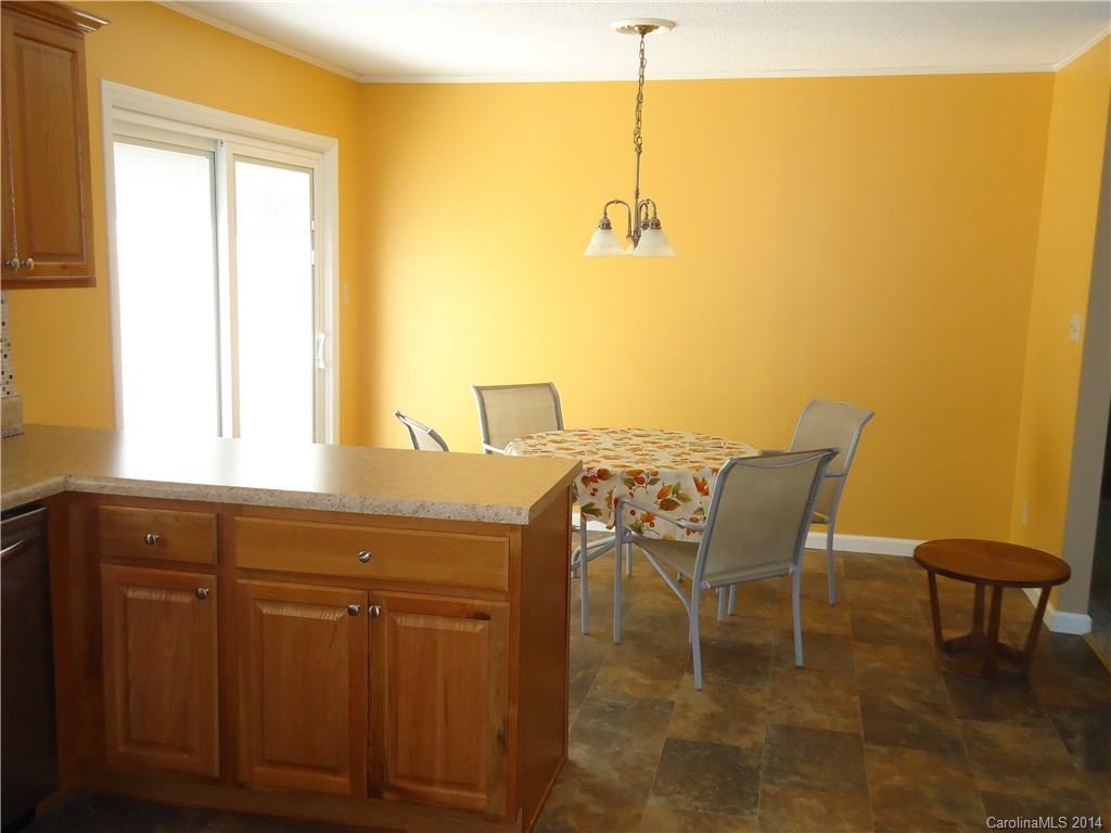 405 Absher Road Bessemer City, NC 28016 - Photo 5 of 15 a view of a dining room with furniture and window