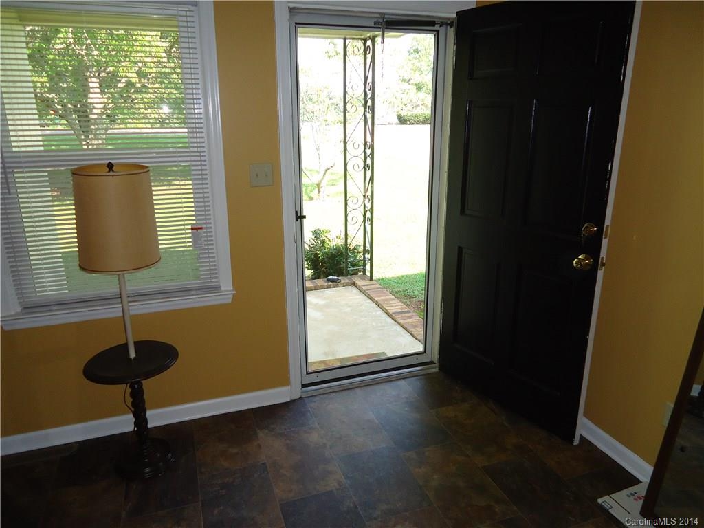 405 Absher Road Bessemer City, NC 28016 - Photo 7 of 15 a view of empty room with window and chandelier