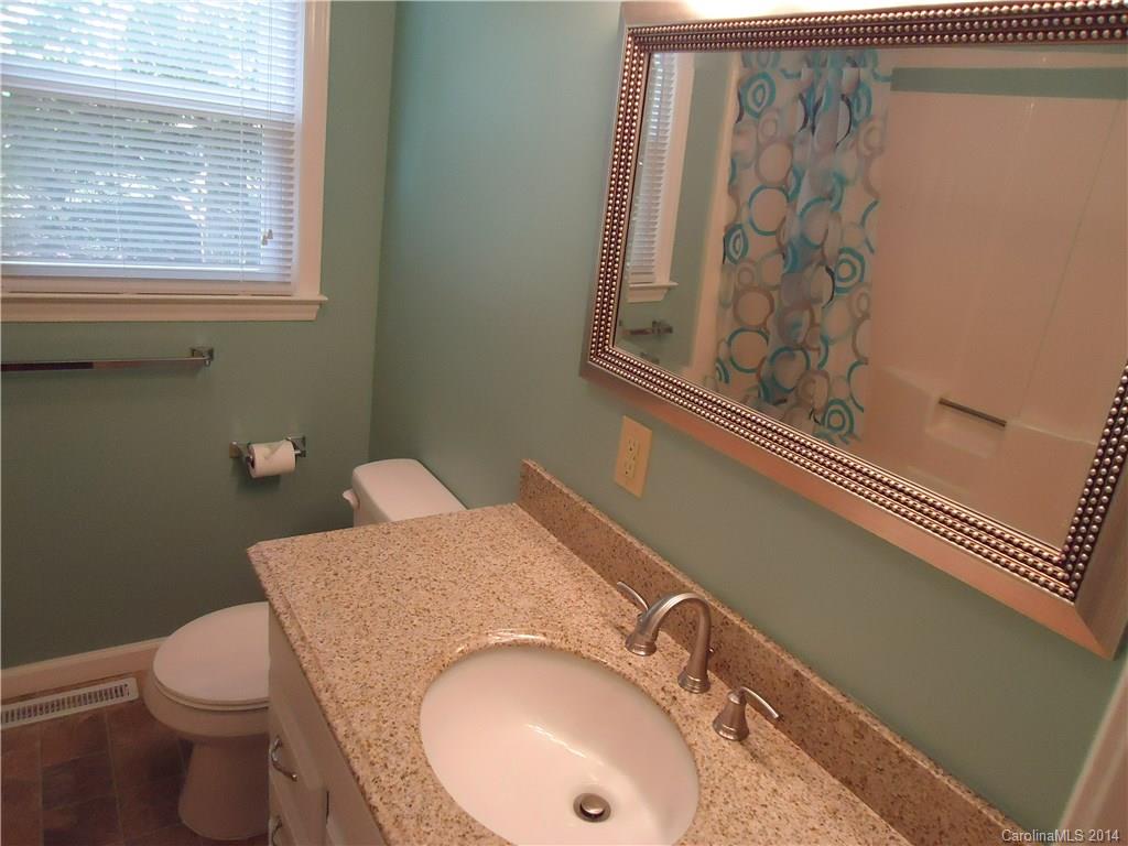 405 Absher Road Bessemer City, NC 28016 - Photo 8 of 15 a bathroom with a sink and toilet
