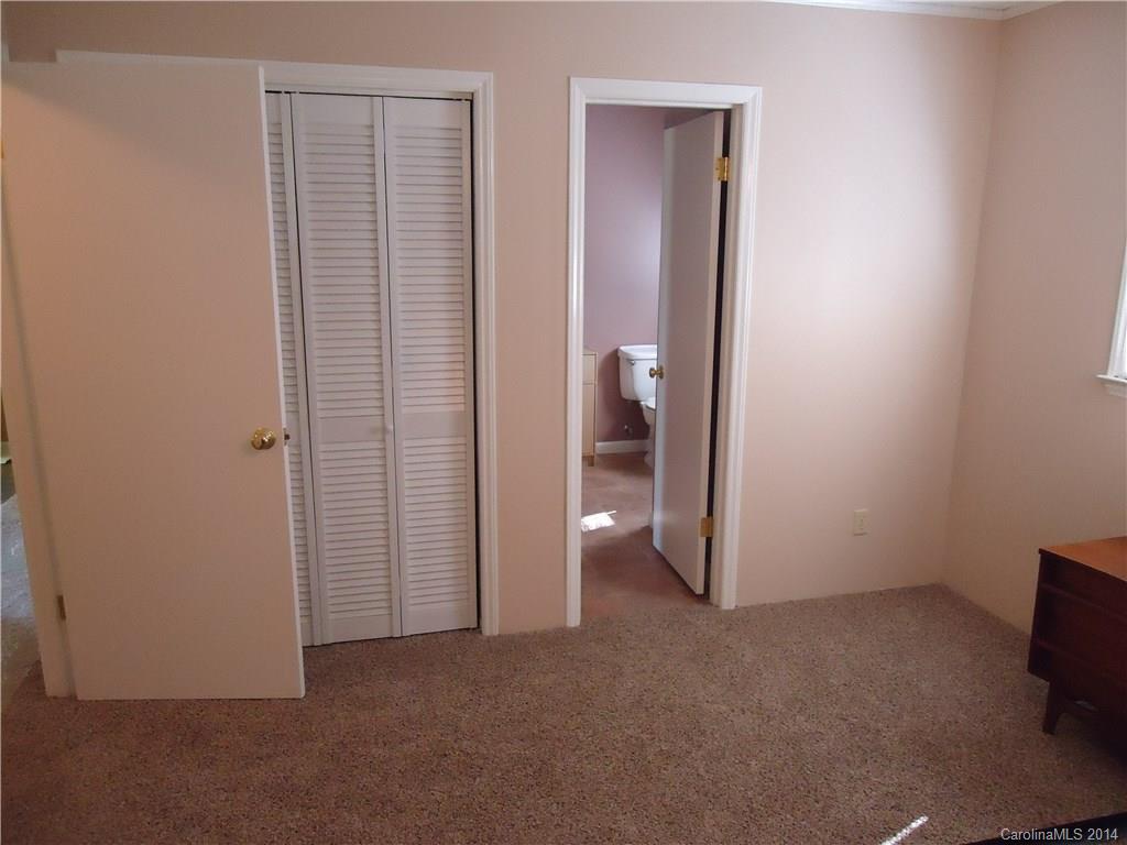 405 Absher Road Bessemer City, NC 28016 - Photo 9 of 15 an empty room with closet and a bathroom
