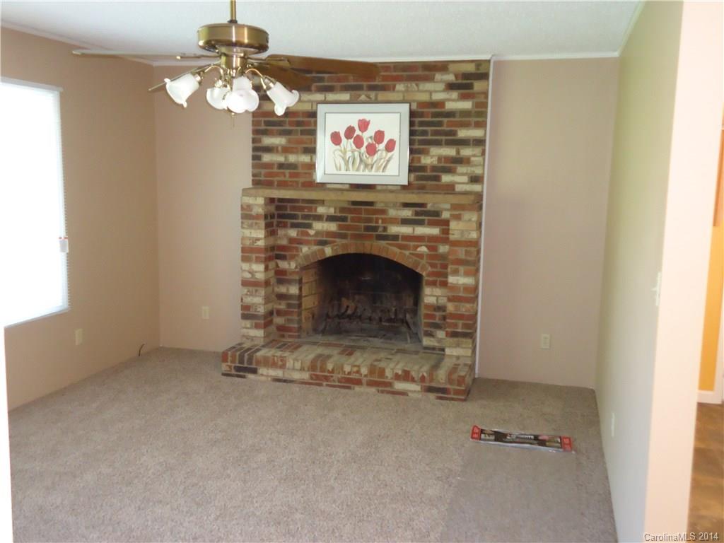 405 Absher Road Bessemer City, NC 28016 - Photo 10 of 15 a view of fireplace with a chandelier