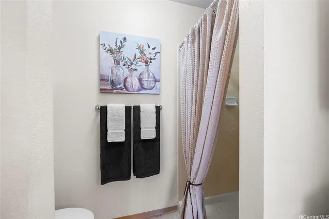 a close view of a utility room with dryer and washer