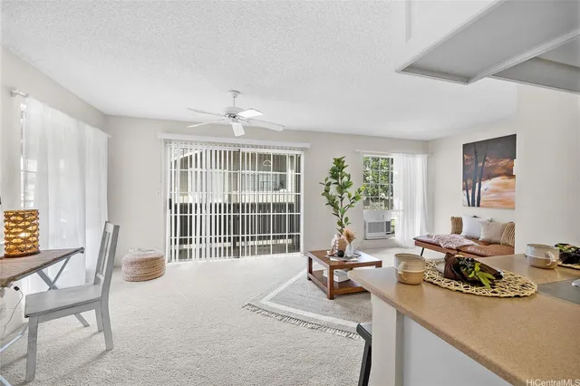 a bedroom with furniture and a large window