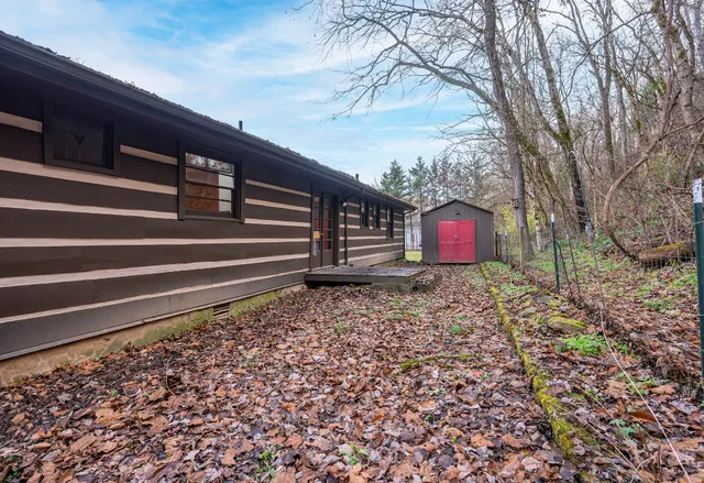 a brick building with a yard