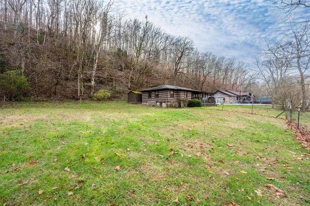 a view of a house with a yard