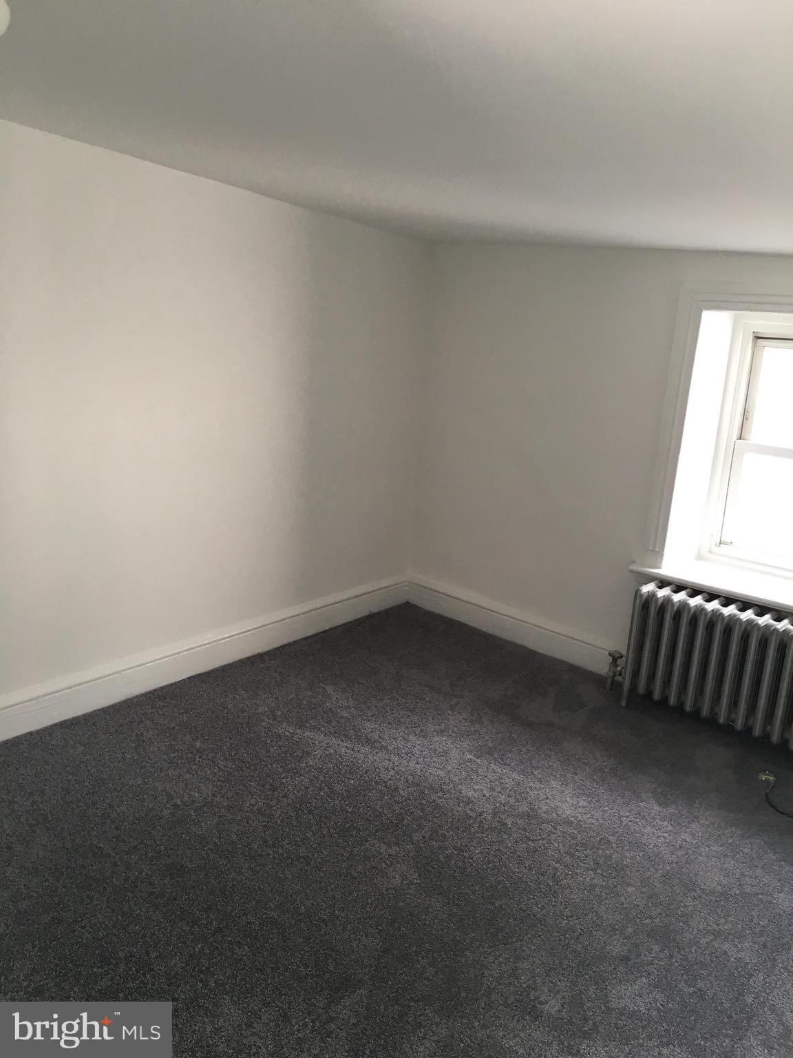 4733 Umbria Street, Unit C Philadelphia, PA 19127 - Photo 11 of 14 a view of an empty room and window
