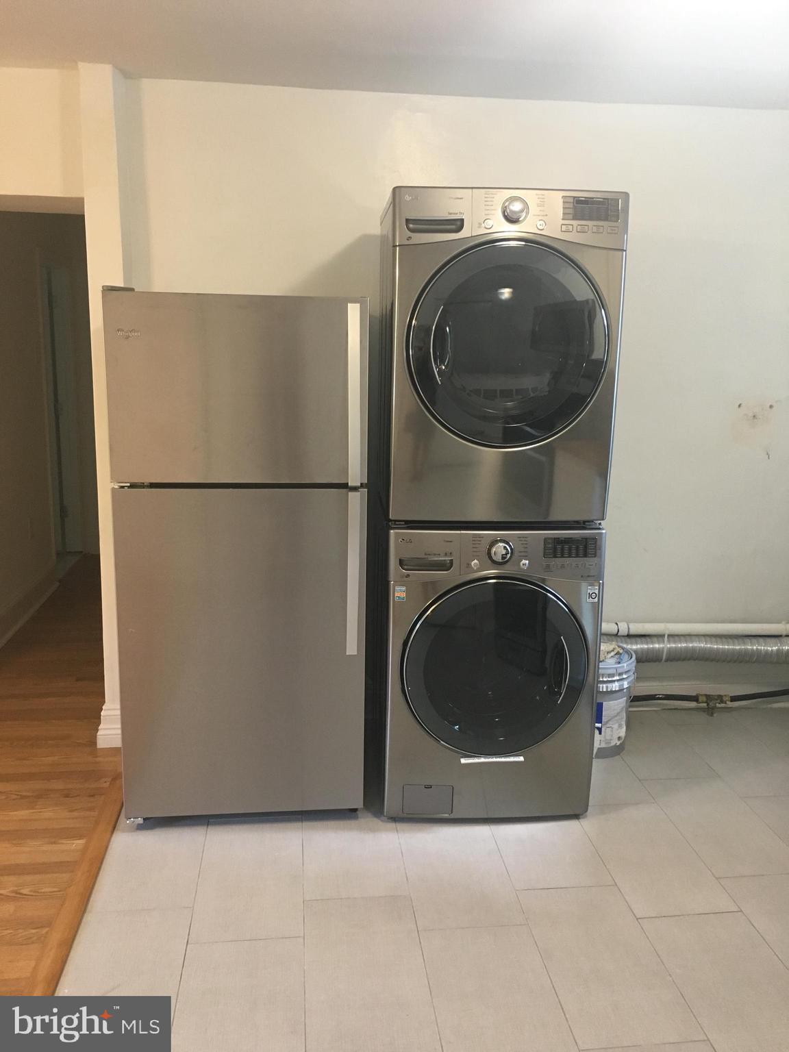 4733 Umbria Street, Unit C Philadelphia, PA 19127 - Photo 3 of 14 a utility room with dryer and washer