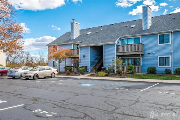 a view of a car park in front of a building