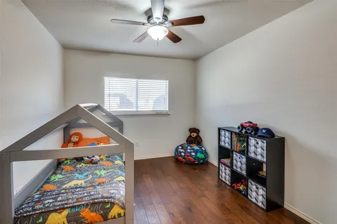 a room with toys and wooden floor