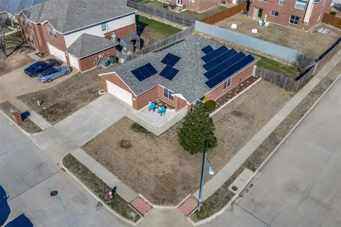 an aerial view of residential house with outdoor space