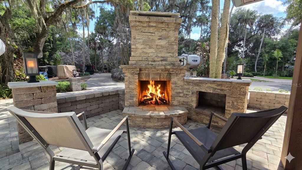 291 Bear Trail River Ranch, FL 33867 - Photo 2 of 23 a view of a patio with couches table and chairs with a fire pit