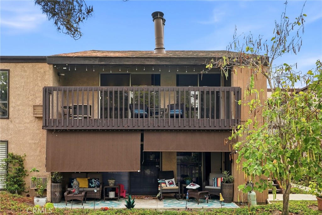7890 East Spring Street, Unit 11E Long Beach, CA 90815 - Photo 6 of 40 a front view of a building with street