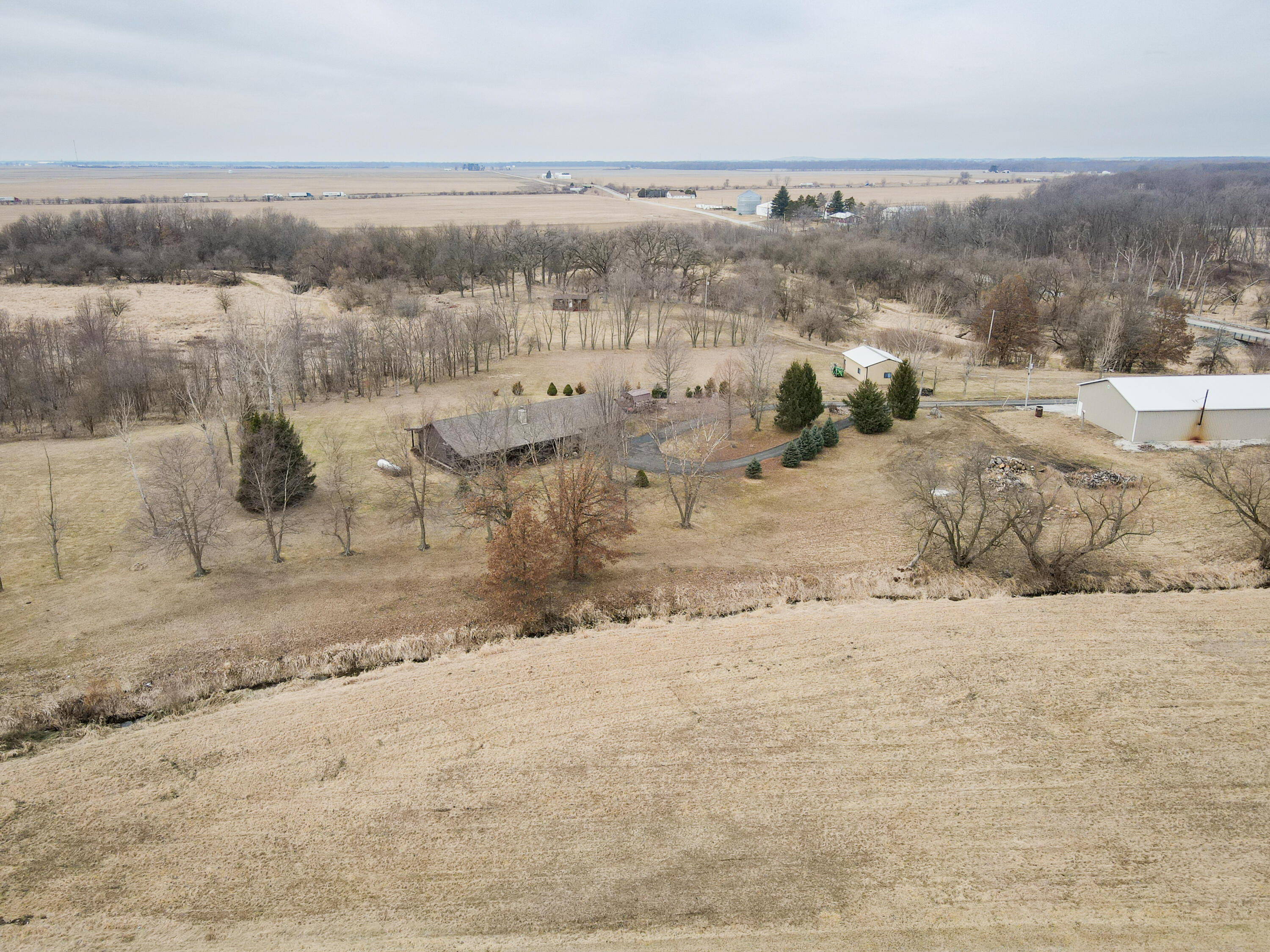 7523 West 850th Street South Rensselaer, IN 47978 - Photo 11 of 39 a view of a dry yard with wooden fence