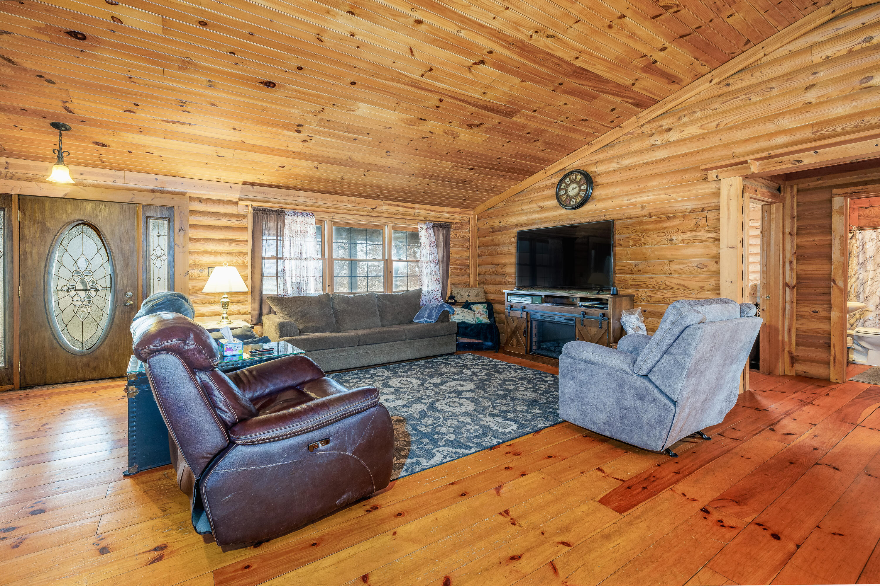 7523 West 850th Street South Rensselaer, IN 47978 - Photo 22 of 39 a living room with furniture and a flat screen tv