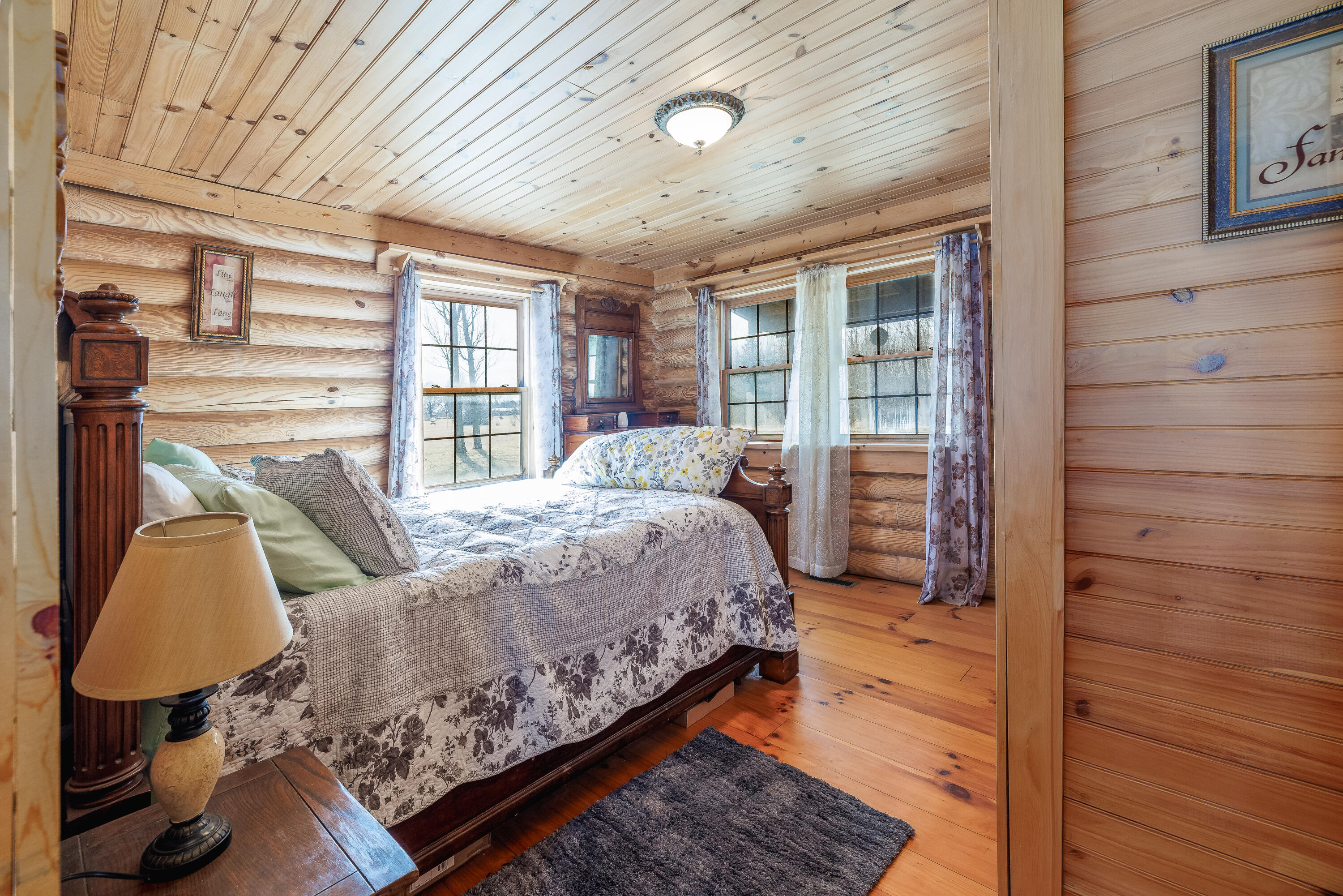 7523 West 850th Street South Rensselaer, IN 47978 - Photo 34 of 39 a bed sitting in a spacious bedroom next to a window