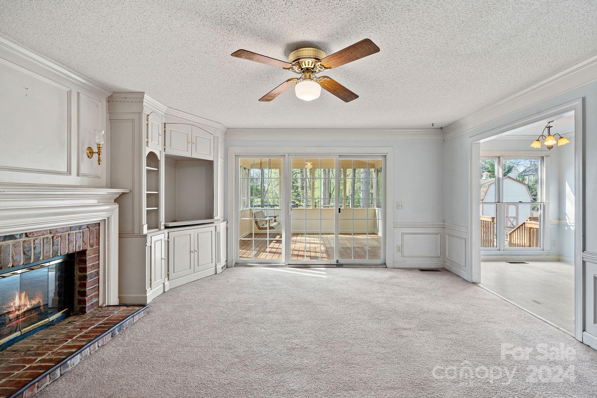 12516 Hawks Ridge Road Huntersville, NC 28078 - Photo 11 of 36 a living room with furniture and a fireplace