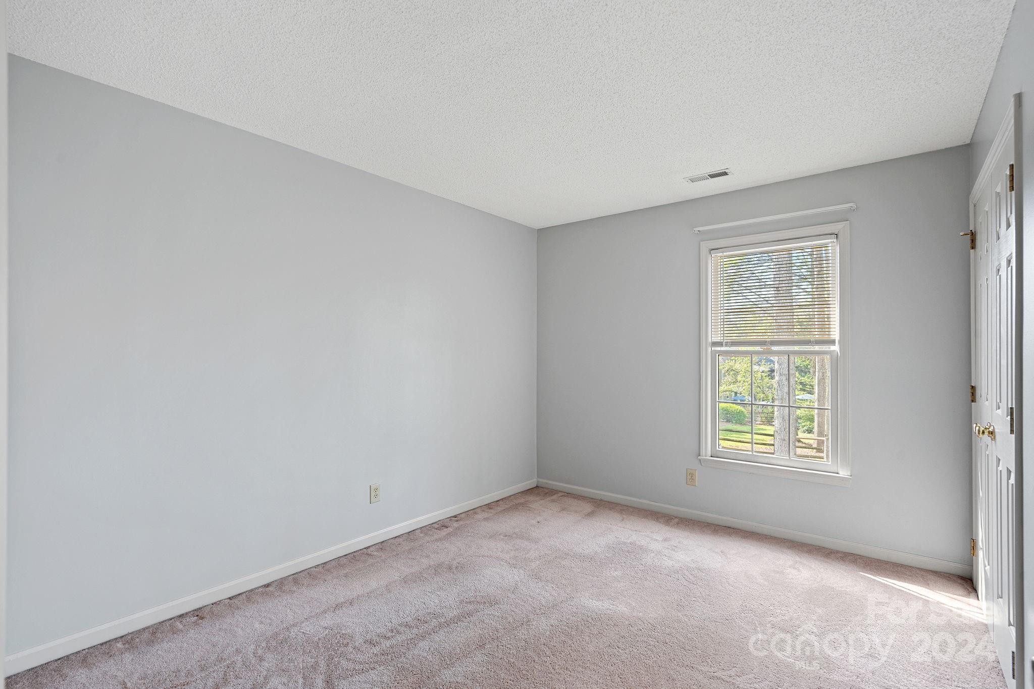 12516 Hawks Ridge Road Huntersville, NC 28078 - Photo 13 of 36 an empty room with windows