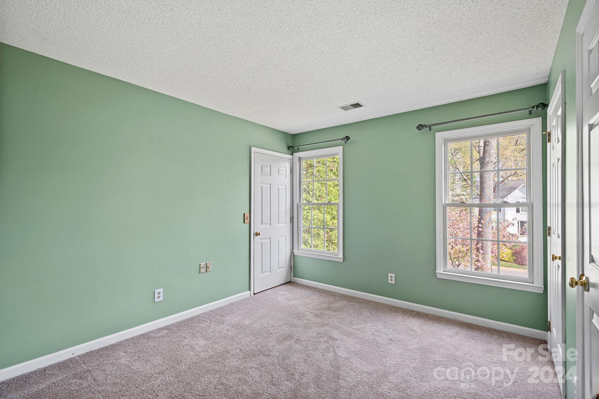 12516 Hawks Ridge Road Huntersville, NC 28078 - Photo 17 of 36 a view of an empty room with window and closet area