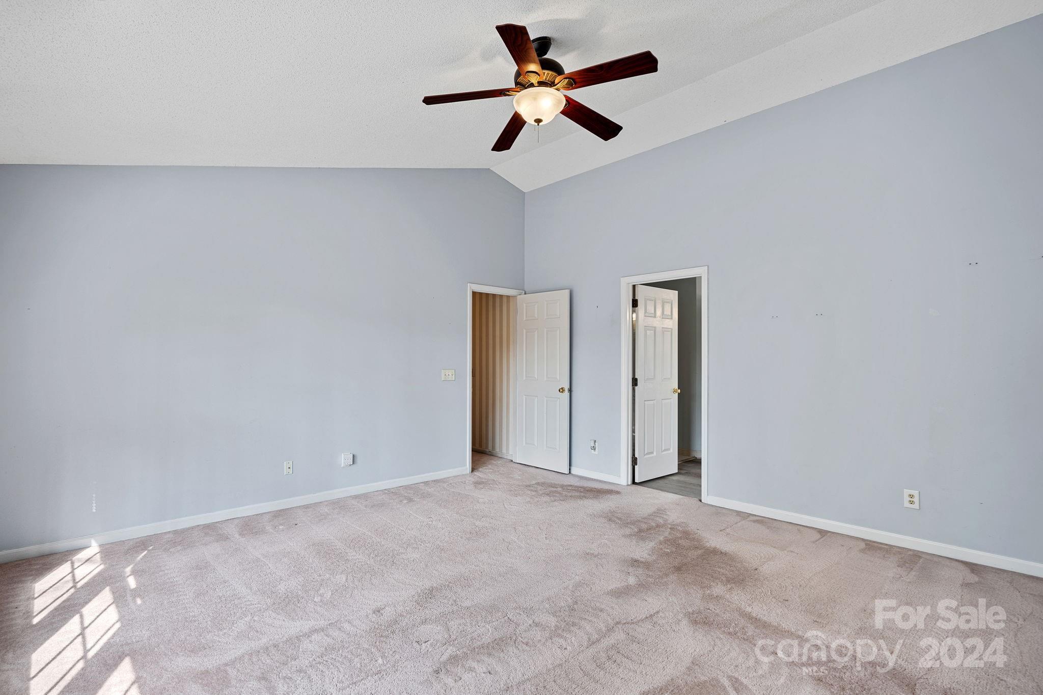 12516 Hawks Ridge Road Huntersville, NC 28078 - Photo 19 of 36 a view of a room with a ceiling fan and a window