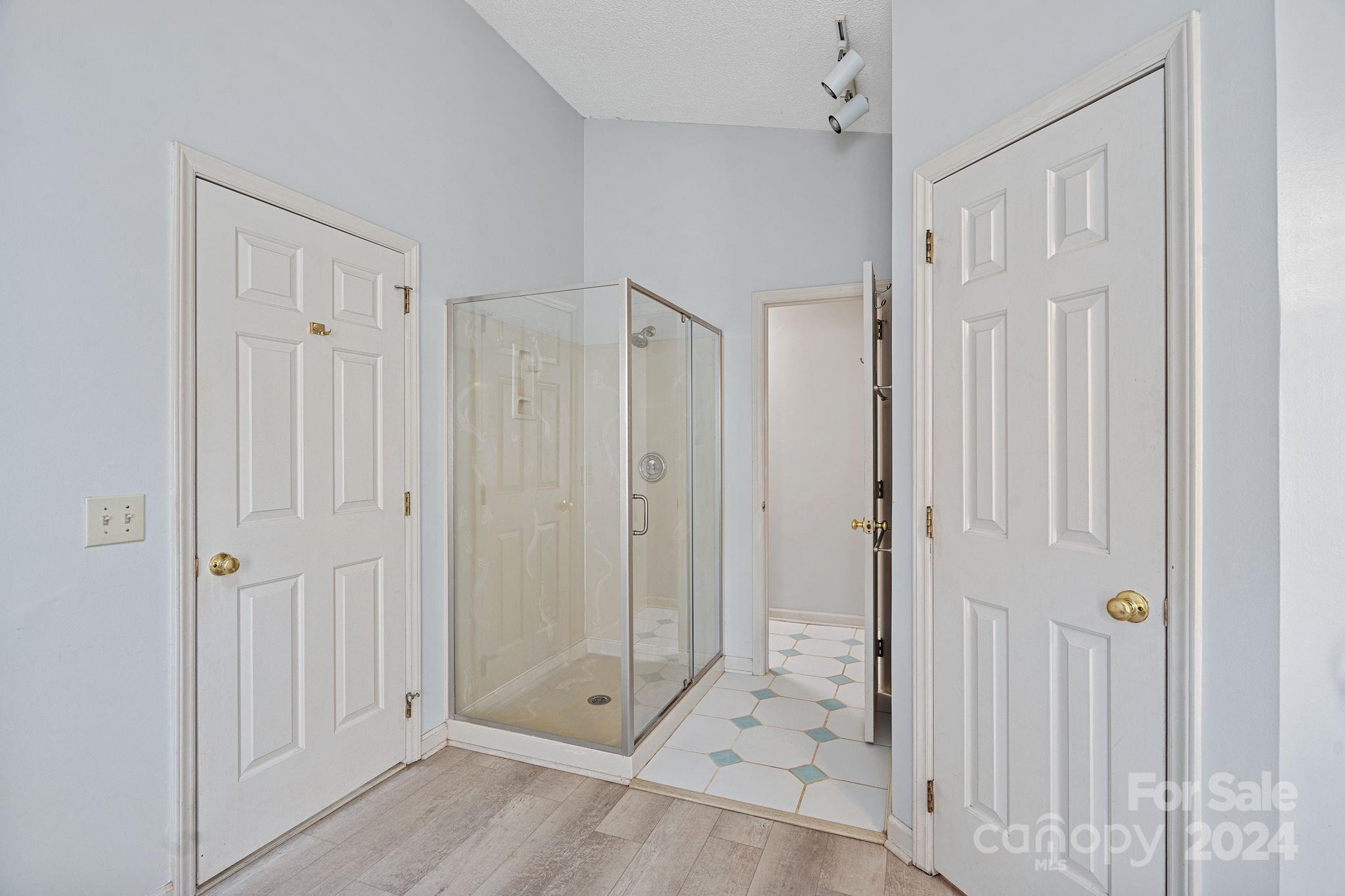 12516 Hawks Ridge Road Huntersville, NC 28078 - Photo 22 of 36 a view of a bathroom with a shower