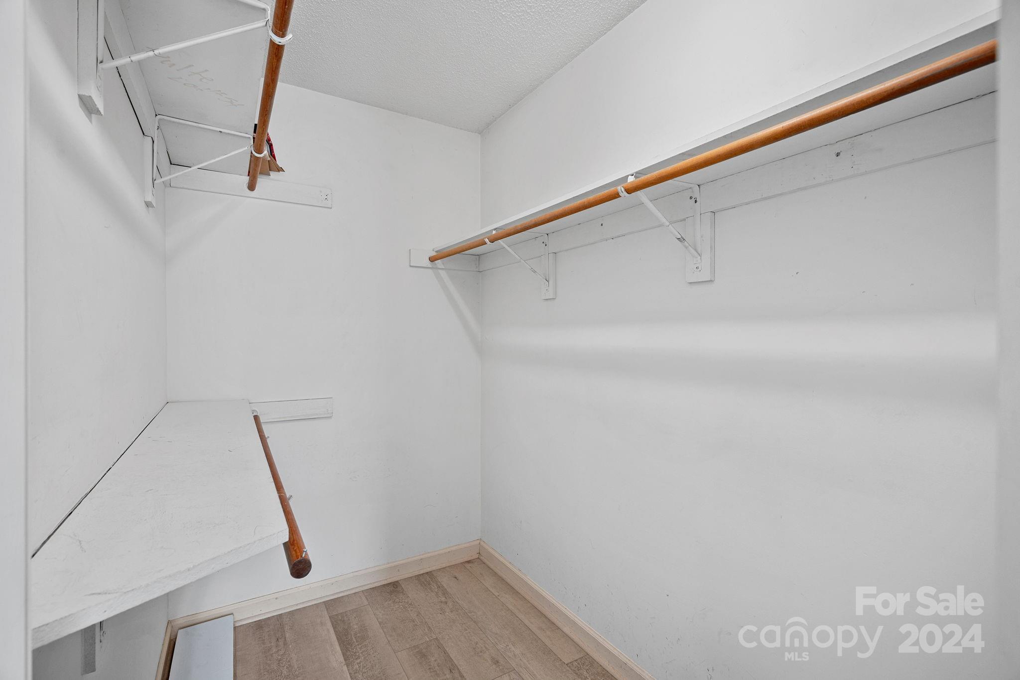 12516 Hawks Ridge Road Huntersville, NC 28078 - Photo 23 of 36 a view of walk in closet with clothes