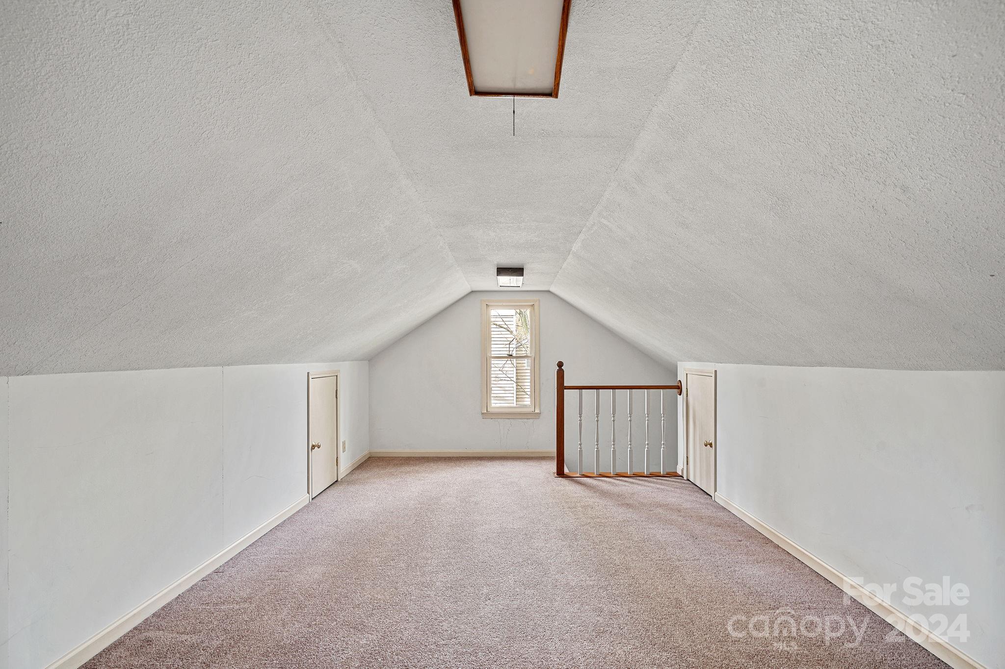 12516 Hawks Ridge Road Huntersville, NC 28078 - Photo 24 of 36 a view of an empty room with a window and cabinet