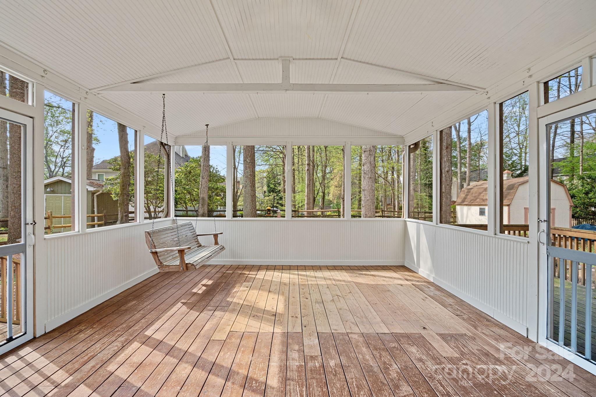 12516 Hawks Ridge Road Huntersville, NC 28078 - Photo 25 of 36 a view of an empty room with wooden floor and a window