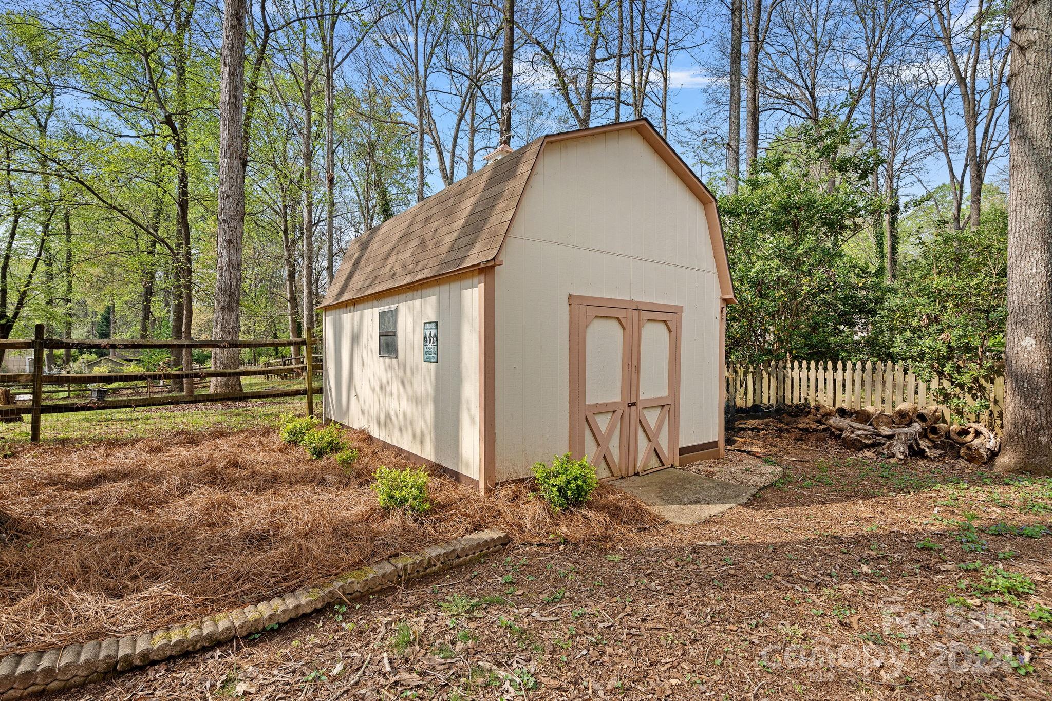 12516 Hawks Ridge Road Huntersville, NC 28078 - Photo 28 of 36 a view of a house with a yard