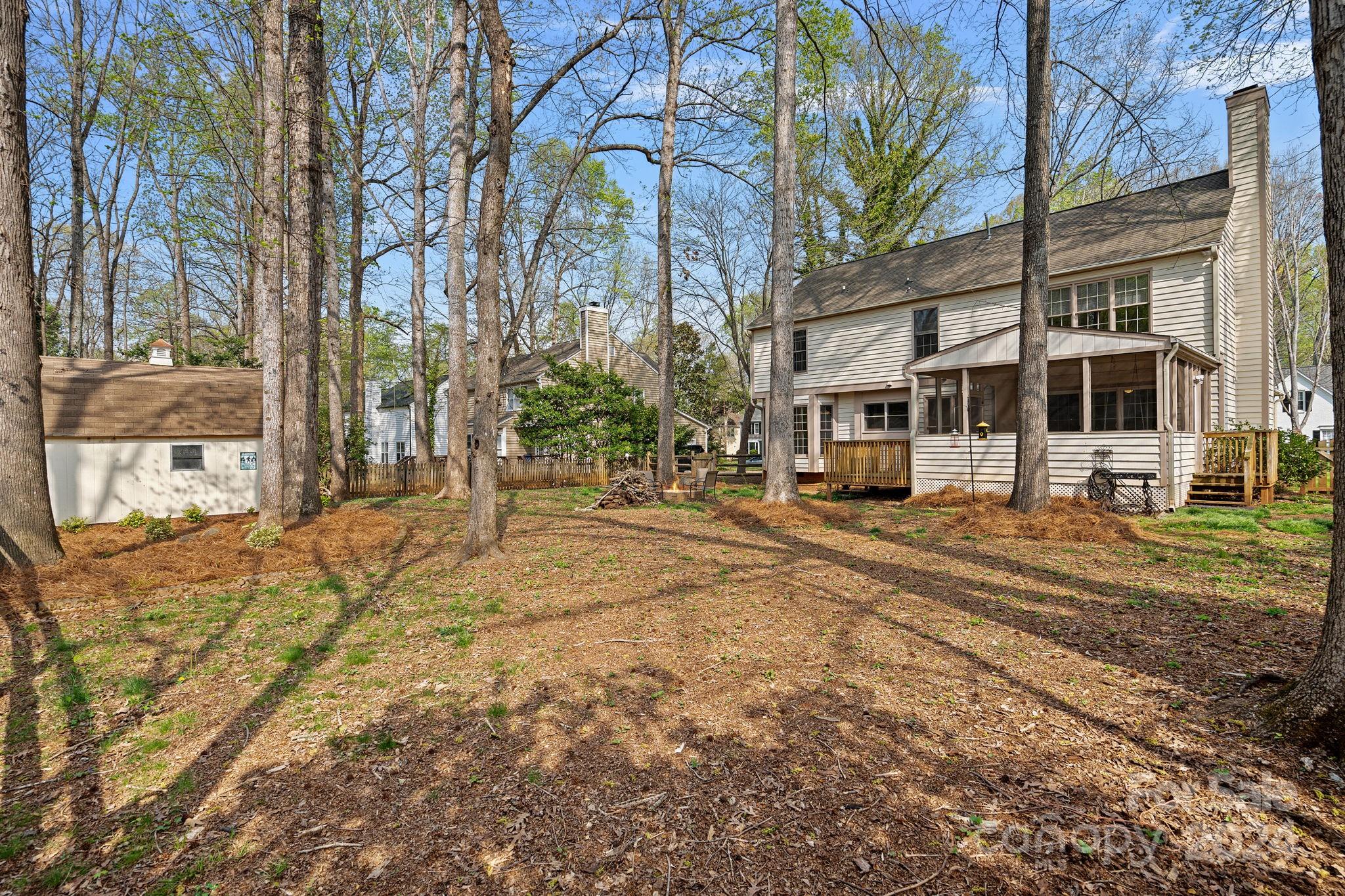 12516 Hawks Ridge Road Huntersville, NC 28078 - Photo 31 of 36 a row of houses with trees in the background