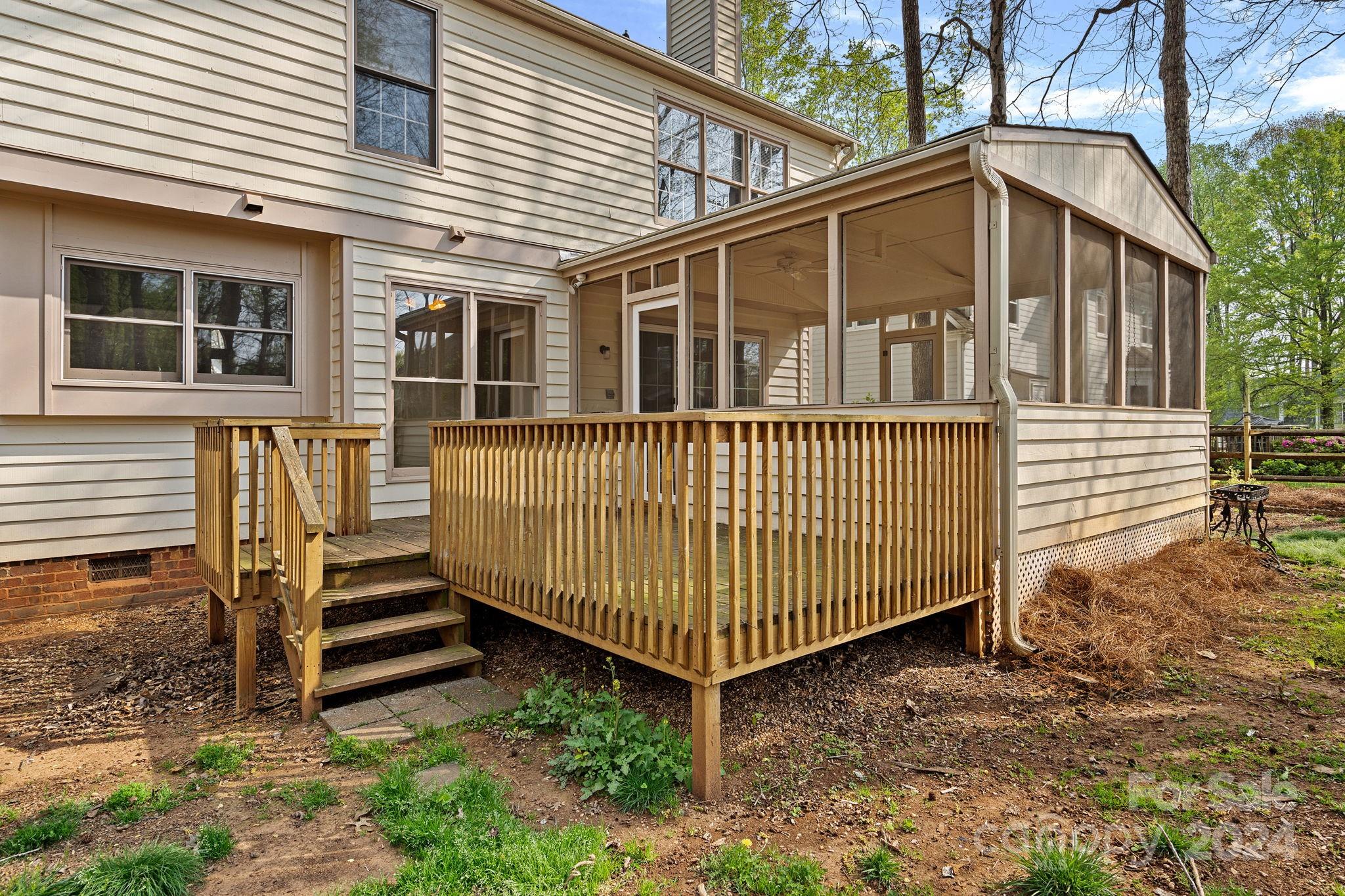 12516 Hawks Ridge Road Huntersville, NC 28078 - Photo 32 of 36 a view of a house with a yard and deck