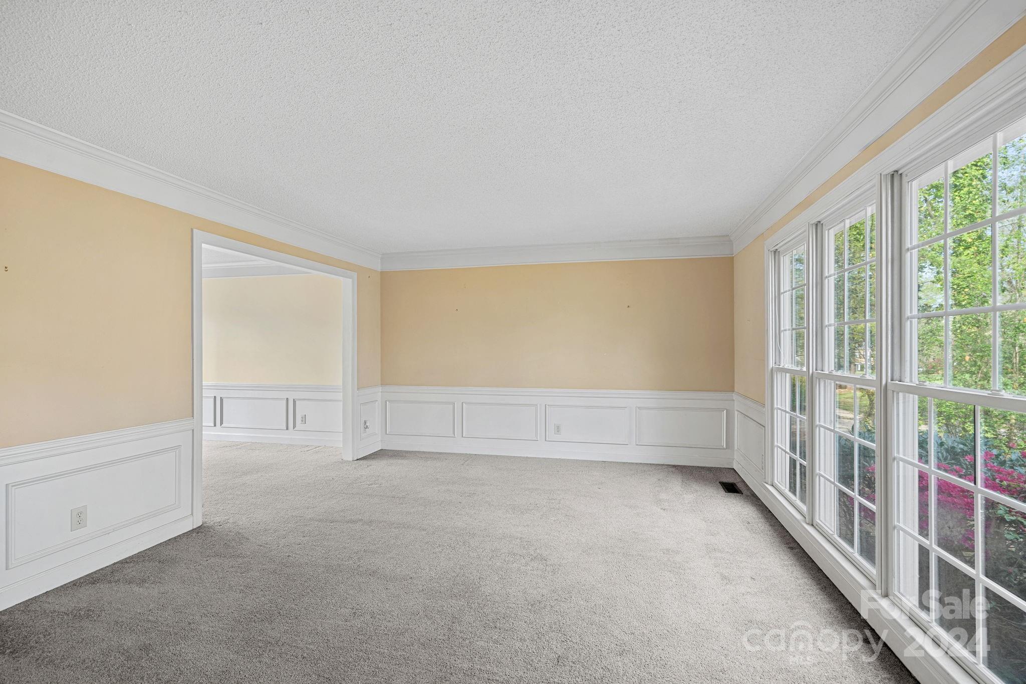 12516 Hawks Ridge Road Huntersville, NC 28078 - Photo 4 of 36 a view of an empty room with a window