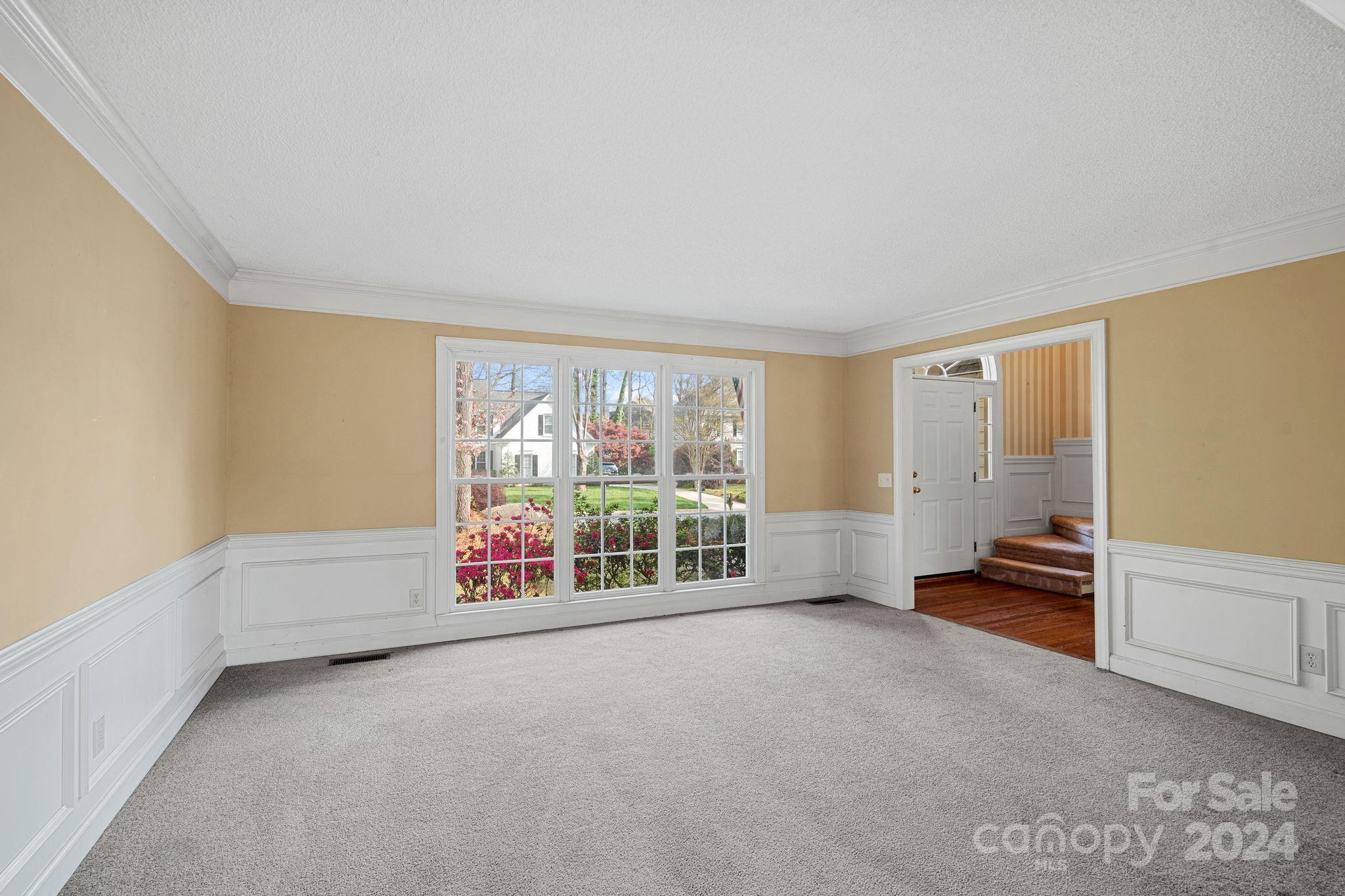 12516 Hawks Ridge Road Huntersville, NC 28078 - Photo 5 of 36 an empty room with furniture and windows